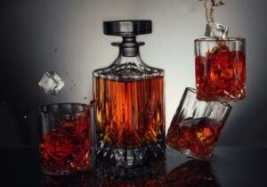 clear glass bottle with red liquid